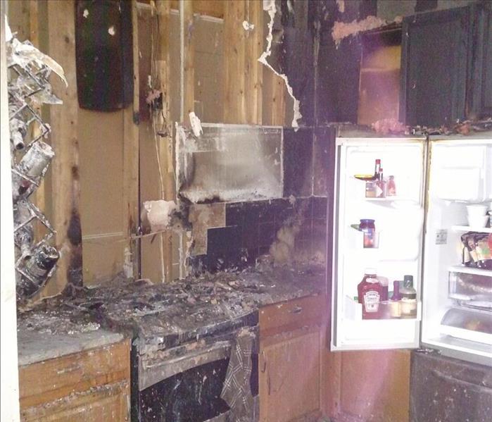 Severly fire damaged kitchen.