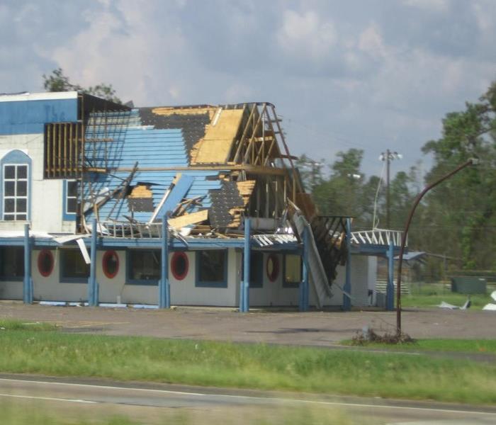 Wind damaged roof of a building.