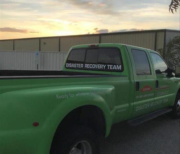 SERVPRO truck parked in front of sunrise.