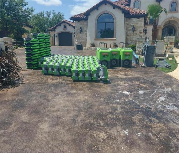 Drying equipment in driveway. 