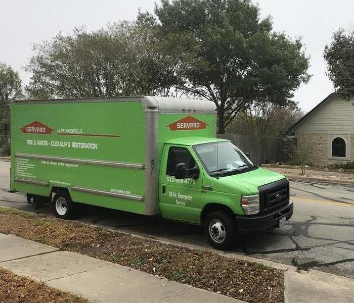 Green truck box of SERVPRO parked