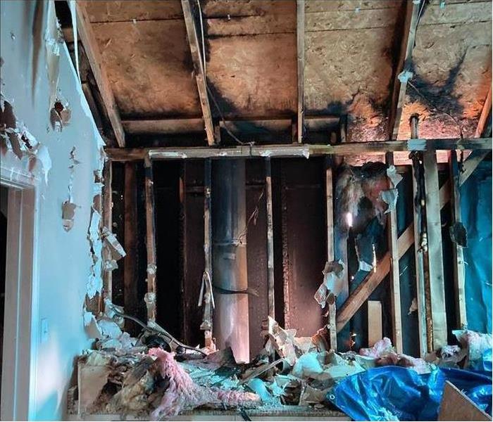 Drywall burned, ceiling burned, fire damage to the interior of a home