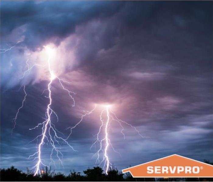 Stormy skies and a SERVPRO logo.